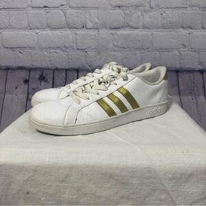 Adidas White Sneakers with Gold Stripes